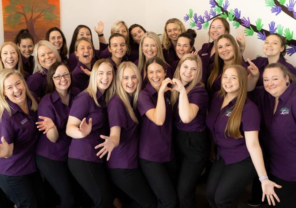 A group of A Growing Understanding employees posing for a group photo.