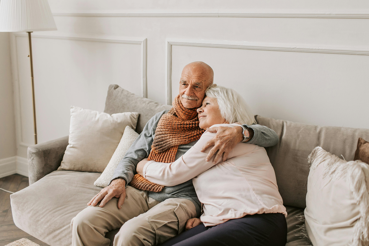 Older couple at home on the sofa