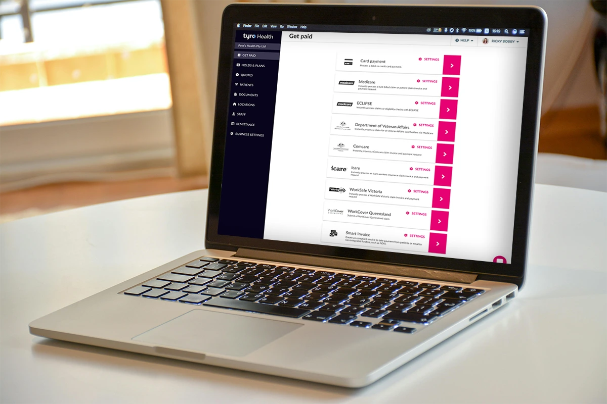 Open laptop displaying the Tyro Health Online platform's claiming interface with options for Medicare, ECLIPSE, and other health fund payments
